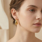 Adya Elegant Golden Teardrop Statement Earrings for Women