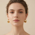 Adya Elegant Golden Teardrop Statement Earrings for Women