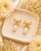 Gold-Toned Bow Pearl Drop Earrings for Women | Crystal Studded Elegant Earrings
